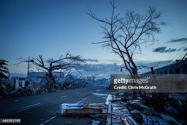 Homemade casket is seen on the side of the road as curfew approaches on November 14, 2013 in Leyte, Philippines. Typhoon Haiyan which ripped through...