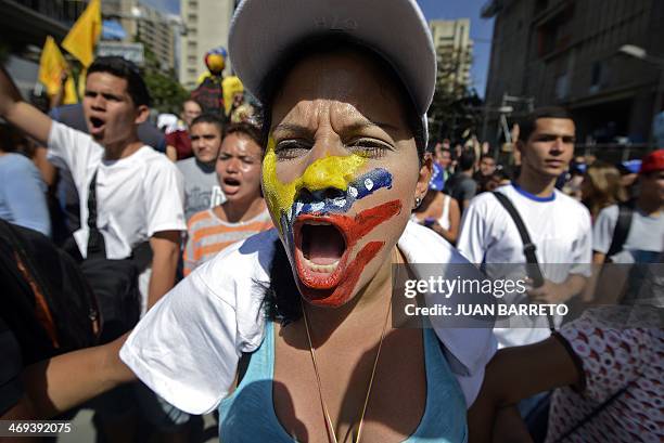 Students demonstrate against the government of Venezuelan President Nicolas Maduro in Caracas on February 13, 2014. Students opposed to the...