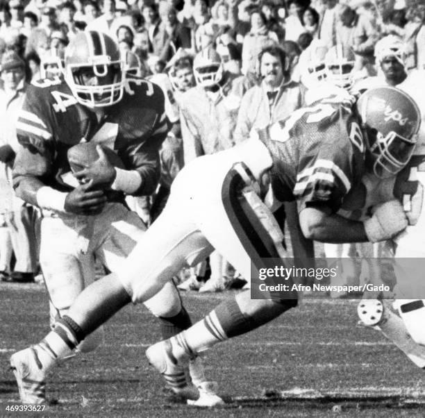 Football players are shown during a Maryland Terrapins, football team representing the University of Maryland, football game, 1980.