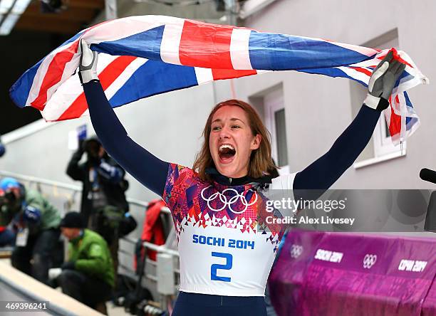 Lizzy Yarnold of Great Britain celebrates winning the gold medal during the Women's Skeleton on Day 7 of the Sochi 2014 Winter Olympics at Sliding...