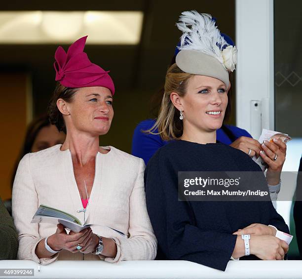 Dolly Maude and Zara Phillips watch the racing as they attend day 3 'Grand National Day' of the Crabbie's Grand National Festival at Aintree...
