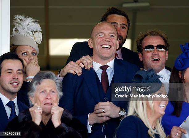 Zara Phillips, Mike Tindall and James Simpson-Daniel watch their horse Monbeg Dude run in the Grand National as they attend day 3 'Grand National...