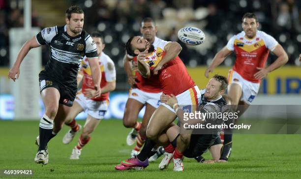 Eloi Pelissier of Catalan Dragons offloads underpressure from Jordan Rankin of Hull FC during the Super League match between Hull FC and Catalans...