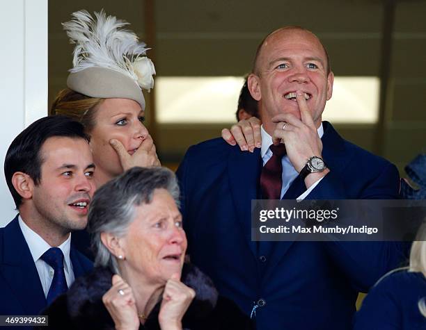 Zara Phillips and Mike Tindall watch his horse Monbeg Dude run in the Grand National as they attend day 3 'Grand National Day' of the Crabbie's Grand...