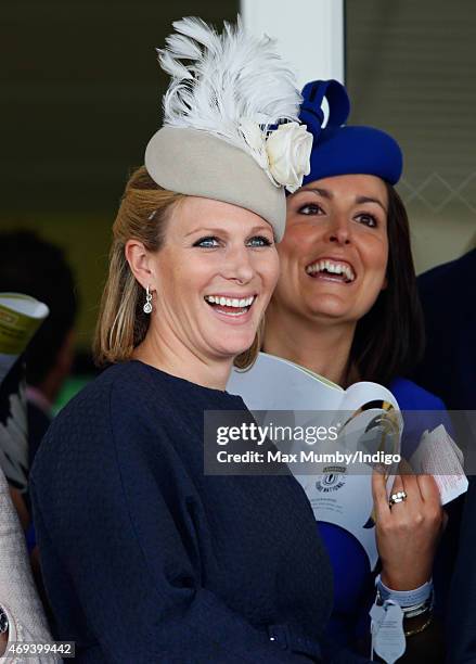 Zara Phillips watches the racing as she attends day 3 'Grand National Day' of the Crabbie's Grand National Festival at Aintree Racecourse on April...