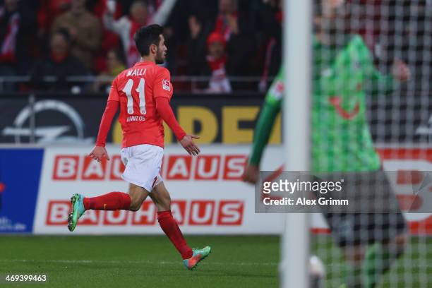 Yunus Malli of Mainz celebrates his team's first goal during the Bundesliga match between 1. FSV Mainz 05 and Hannover 96 at Coface Arena on February...