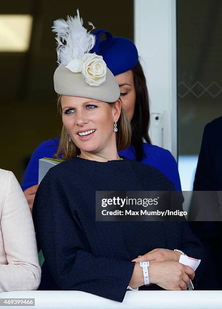 Zara Phillips watches the racing as she attends day 3 'Grand National Day' of the Crabbie's Grand National Festival at Aintree Racecourse on April...