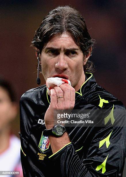 Referee Mauro Bergonzi is injured during the Serie A match between AC Milan and Bologna FC at San Siro Stadium on February 14, 2014 in Milan, Italy.