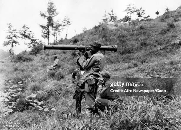 An American soldier aims his bazooka on the front lines during the Korean War, Korea, July 18, 1950.