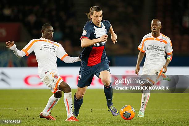 Paris' Swedish forward Zlatan Ibrahimovic vies for the ball with Valenciennes' French forward Francis Massampu during the French L1 football match...