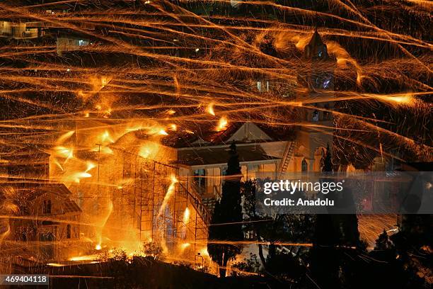 St. Mark's and Panagia Erithiani church congregations perform 'Rocket War' by firing thousands of home-made rockets across the sky during Greek...