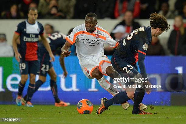 Valenciennes' French midfielder Tongo Hamed Doumbia vies for the ball with Paris' French midfielder Adrien Rabiot during the French L1 football match...