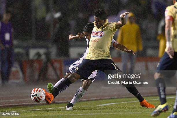 Severo Meza of Monterrey fights for the ball with Michael Arroyo of America during a match between Monterrey and America as part of 13th round of...