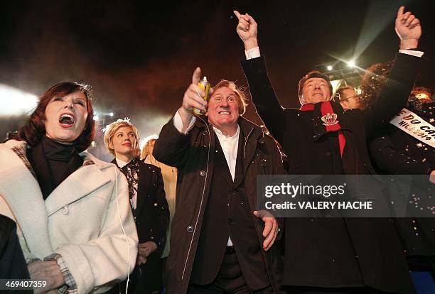 French actor Gerard Depardieu , French former TV host Denise Fabre , his partner Clementine Igou and Nice's mayor Christian Estrosi attend the Nice...