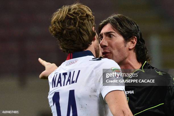 Referee Mauro Bergonzi argues with Bologna's defender Cesare Natali during the Serie A football match between AC Milan and Bologna at San Siro...