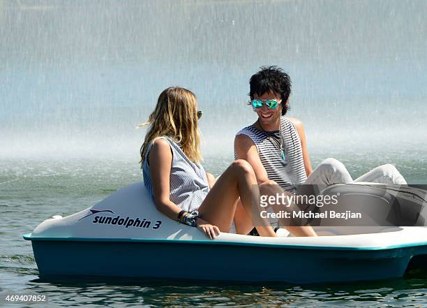 Actress/Model Keeley Hazell paddles a boat with Dominic Howard of 'Muse' at Riviera Brunch hosted by GREY GOOSE at Soho Desert House on April 11,...