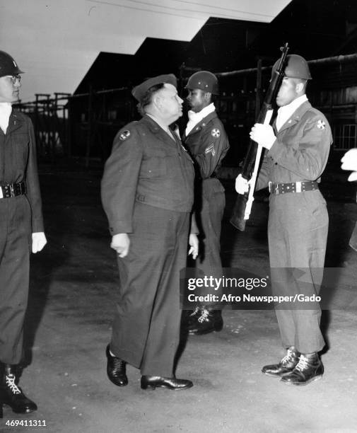 General Pearson Menoher inspecting the Guard of Honor prior to the formal opening of the Club Sixty Niner at Camp Loeper, Sendai, Japan, April 22,...