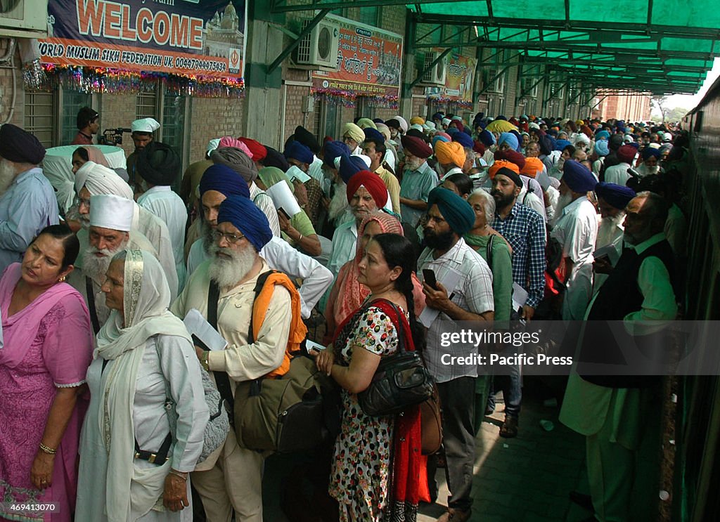 Indian Sikh pilgrims arrive at Wagah railway station in the...