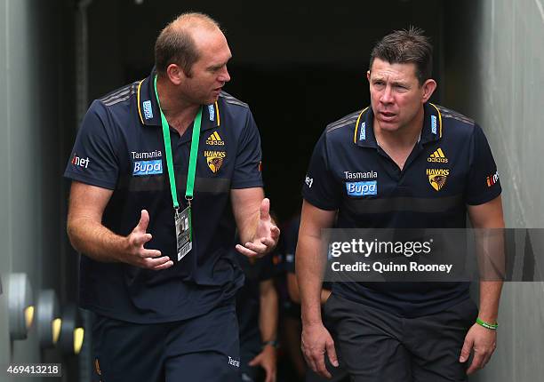 David Neitz and Brett Ratten the assistant coach of the Hawks walk out of the rooms during the round two AFL match between the Essendon Bombers and...