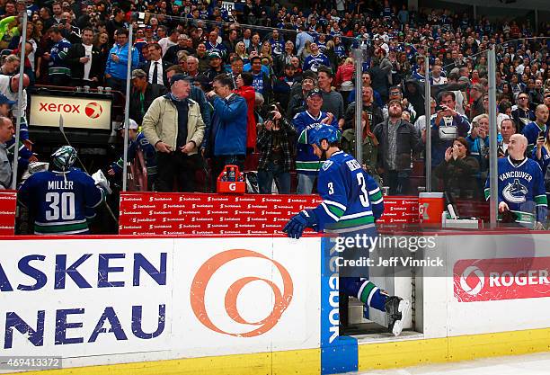 Kevin Bieksa of the Vancouver Canucks is the last player to leave the ice as the 2014-2015 NHL season concludes with their game against the Edmonton...