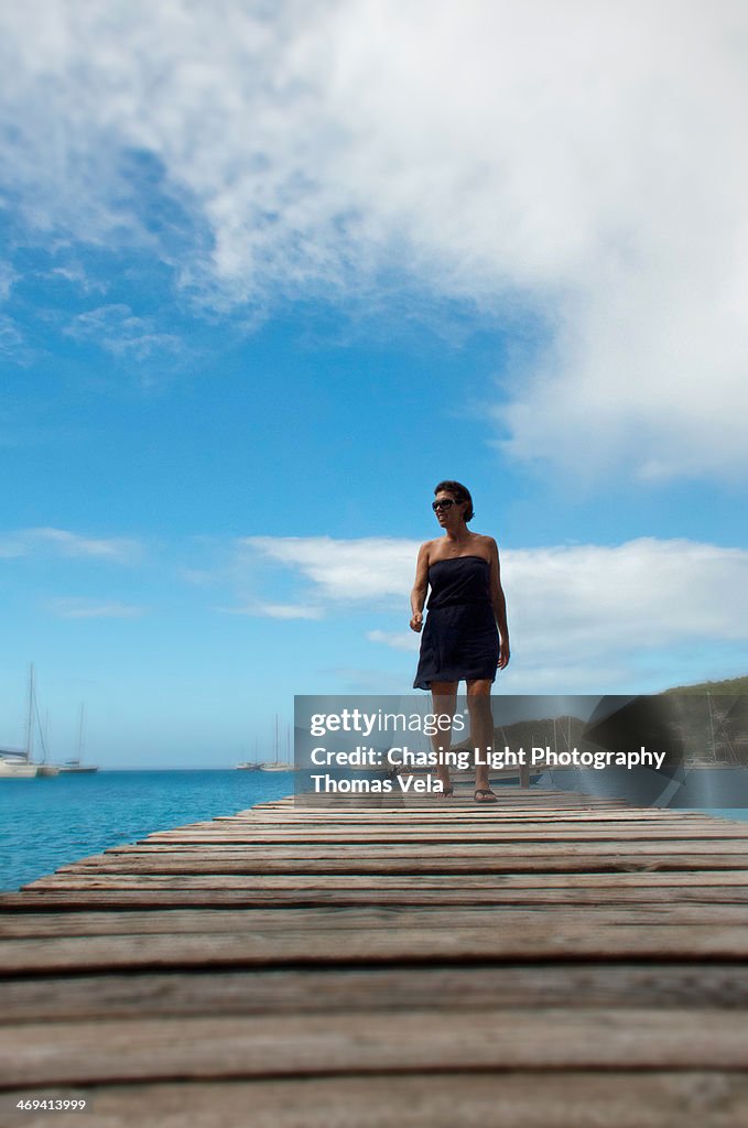 Woman walking on a boat dock