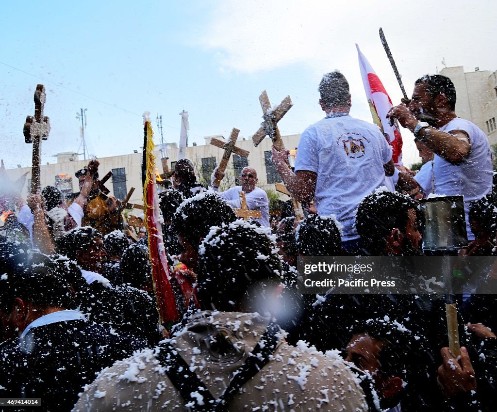 Palestinian Christian men cheer and dance in triumph in the...