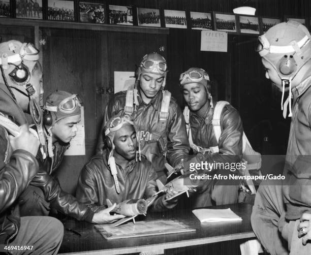 Recent pilot graduates from Tuskegee Army Flying School practice manoeuvres with model planes, Tuskegee, Alabama, 1943.