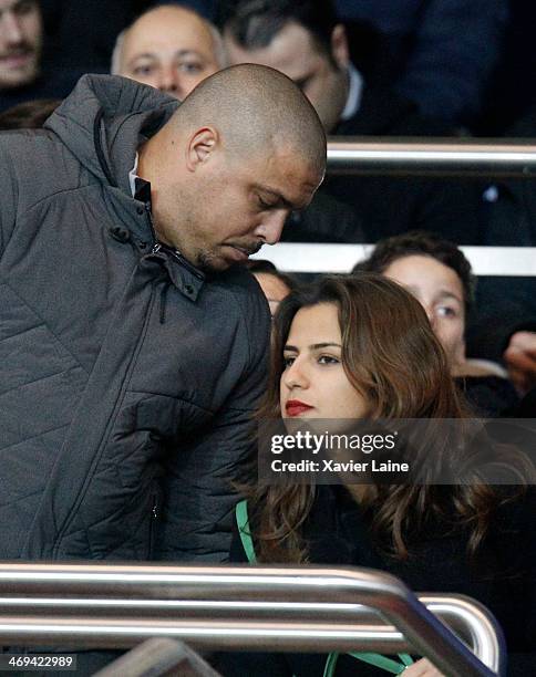 Ronaldo Luis Nazario and his girlfriend attend the French Ligue 1 between Paris Saint-Germain FC and Valenciennes VAFC at Parc Des Princes on...