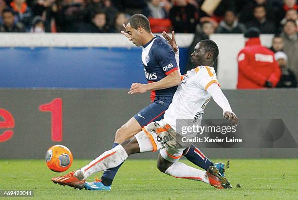 Lucas Moura of Paris Saint-Germain and Hamed Doumbia of Valenciennes VAFC in action during the French Ligue 1 between Paris Saint-Germain FC and...