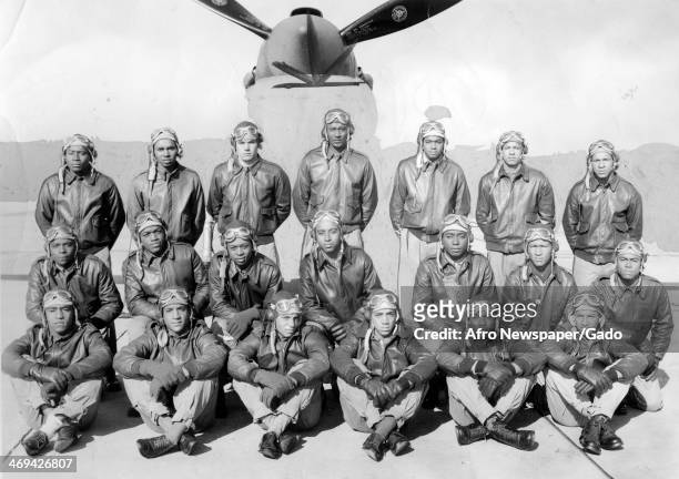 Tuskegee Airmen receiving their commissions at a parade at Tuskegee Army Airfield, with an airplane in the background, during World War 2, Tuskegee,...