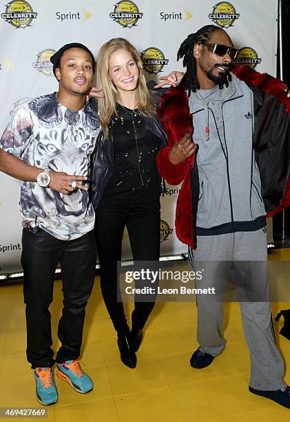 Romeo Miller, Erin Heatherton, and Snoop Dogg attend the NBA All-Star Celebrity Game 2014 at the New Orleans Arena on February 14, 2014 in New...