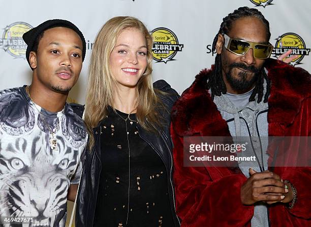 Romeo Miller, Erin Heatherton, and Snoop Dogg attend the NBA All-Star Celebrity Game 2014 at the New Orleans Arena on February 14, 2014 in New...