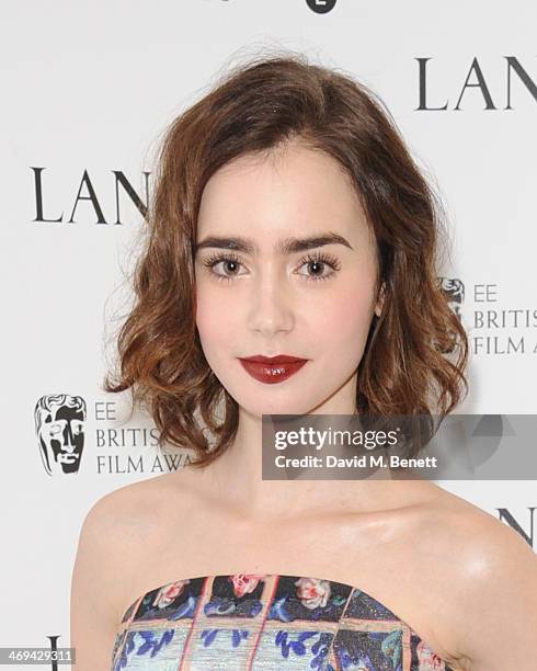 Lily Collins attends the Lancome pre-BAFTA party hosted by Lily Collins at The London Edition Hotel on February 14, 2014 in London, England.