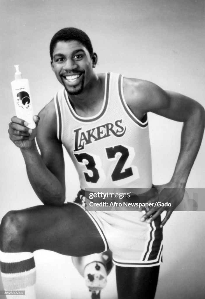 A half length portrait of basketball player Magic Johnson, wearing