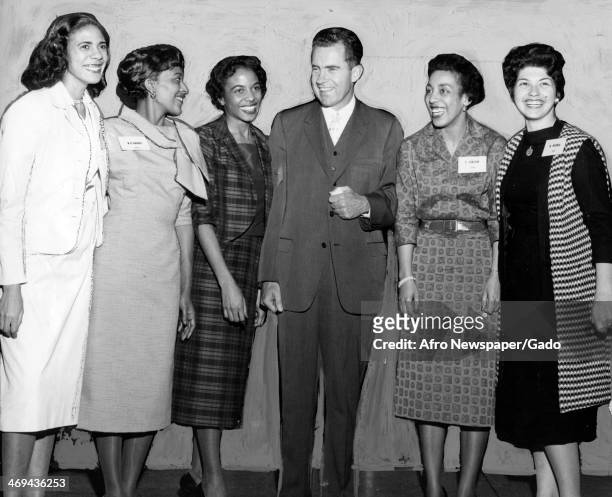 Portrait of Vice President Richard Nixon with hostesses, from left to right, Mesdames Thelma Gibson, Natalie Werber, Mignon Mundy and Miss Yvonne...