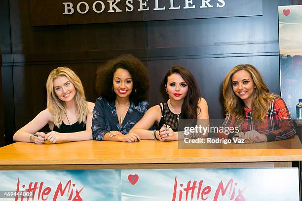 Singers Perrie Edwards, Leigh-Anne Pinnock, Jesy Nelson and Jade Thirlwall of Little Mix sign copies of their album "Salute" at Barnes & Noble...