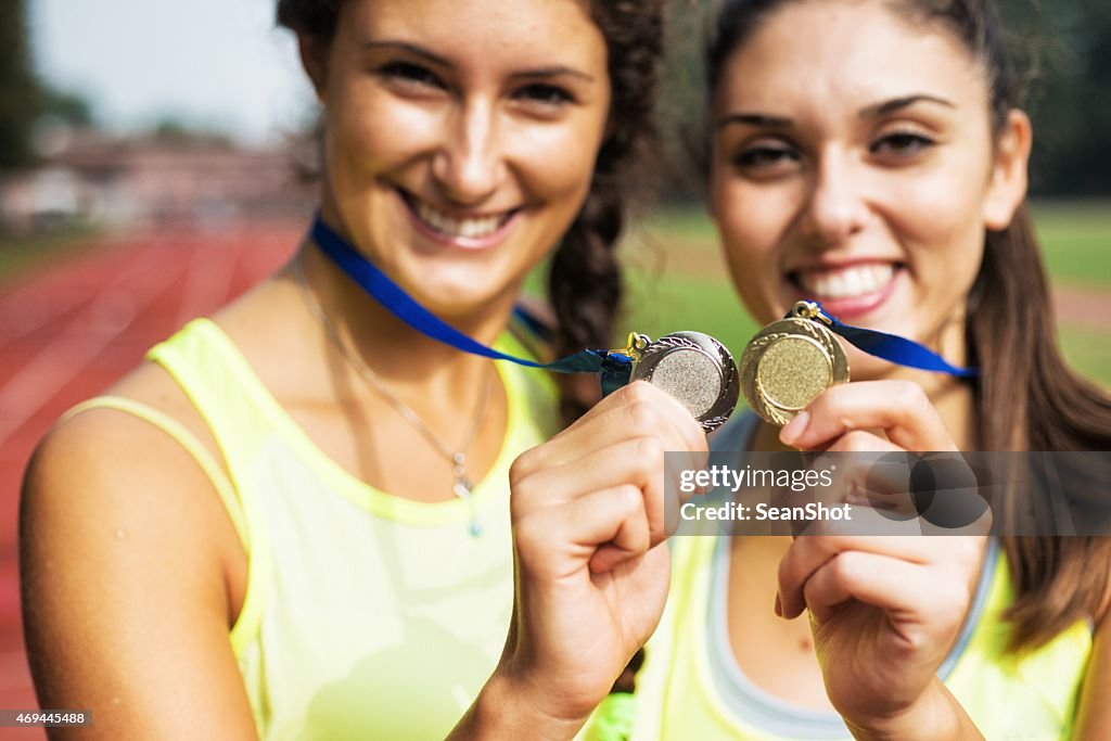 Athletes showing medals