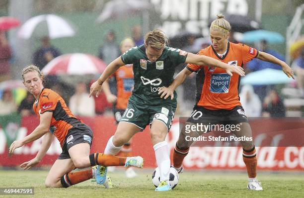 Lori Lindsey of Canberra United is attacked by Elise Kellond-Knight and Katrina-Lee Gorry of Brisbane Roar during the W-League Semi Final match...