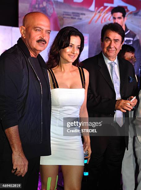 Indian Bollywood actors Rakesh Roshan, Ameesha Patel, and Randhir Kapoor an pose during a promotional event for the upcoming Hindi film Desi Magic in...