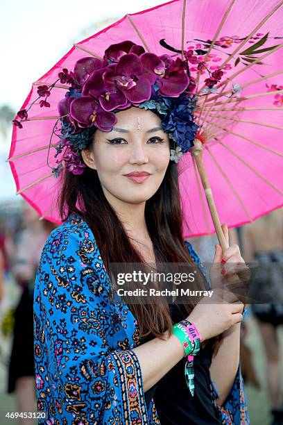 Festival attendee Catherine Ahn wears a floral headdress from Ms G designs during the 2015 Coachella Valley Music and Arts Festival - Weekend 1 at...