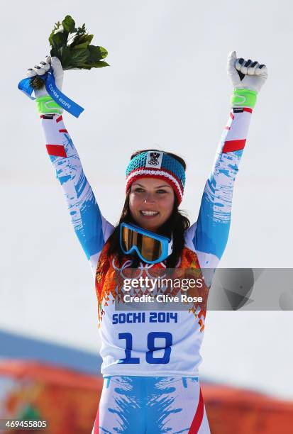 Gold medalist Anna Fenninger of Austria celebrates during the flower ceremony for the Alpine Skiing Women's Super-G on day 8 of the Sochi 2014 Winter...