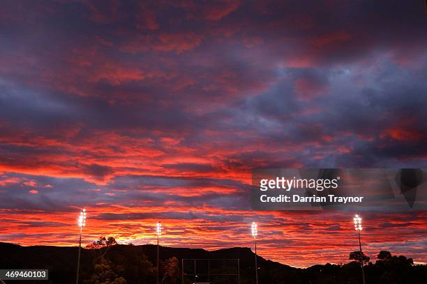 The sun sets over the Imparja Cup Final between New South Wales and Western Australia at Traeger Park on February 15, 2014 in Alice Springs,...
