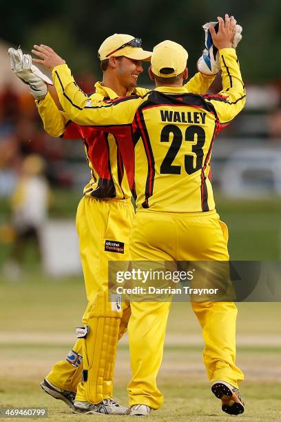 Aarron Muir-Collier and Yagan Walley celebrate a wicket during the Imparja Cup Final between New South Wales and Western Austrlia at Traeger Park on...