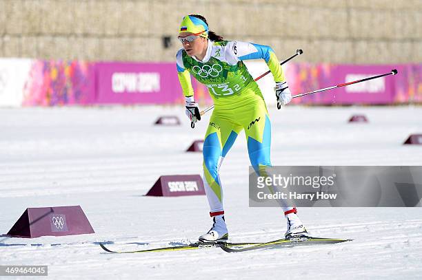 Katja Visnar of Slovenia competes on the second leg in the Women's 4 x 5 km Relay during day eight of the Sochi 2014 Winter Olympics at Laura...