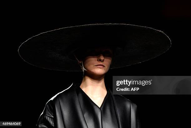 Model presents Autumn/Winter 2014-2015 collection creations by Martin Lamothe during Madrid Fashion Week in Madrid on February 15, 2014. AFP PHOTO /...