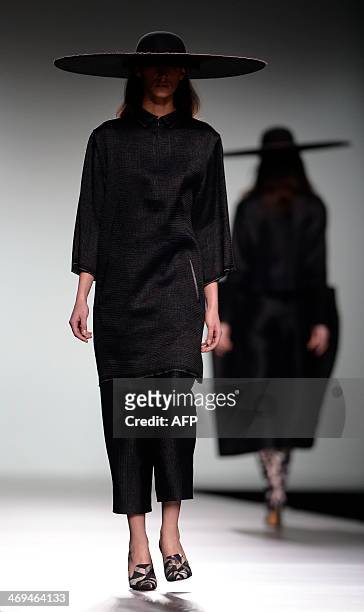 Models present Autumn/Winter 2014-2015 collection creations by Martin Lamothe during Madrid Fashion Week in Madrid on February 15, 2014. AFP PHOTO /...