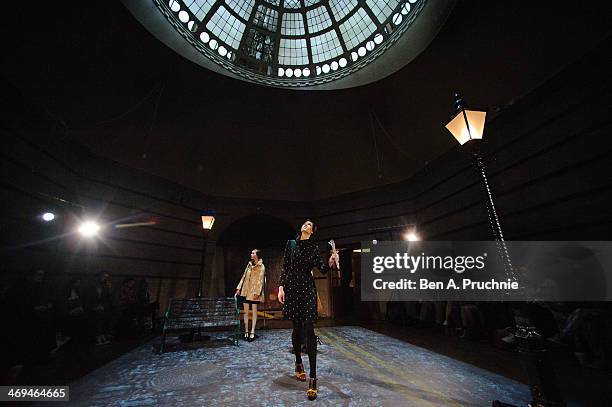 Model walks during the Orla Kiely presentation at London Fashion Week AW14 at Central Saint Martins on February 15, 2014 in London, England.