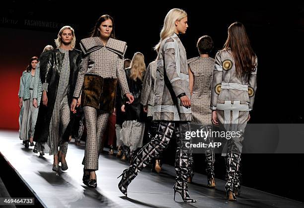 Models present Autumn/Winter 2014-2015 collection creations by Martin Lamothe during Madrid Fashion Week in Madrid on February 15, 2014. AFP PHOTO /...