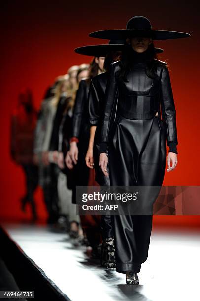 Models present Autumn/Winter 2014-2015 collection creations by Martin Lamothe during Madrid Fashion Week in Madrid on February 15, 2014. AFP PHOTO /...