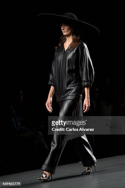 Model showcases designs by Martin Lamothe on the runway at Martin Lamothe show during Mercedes Benz Fashion Week Madrid Fall/Winter 2014 at Ifema on...